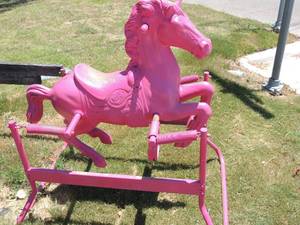 lot 439 image: Pink bouncy horse works great all springs in tact 40x27x38
