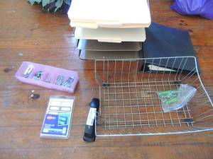 lot 451 image: Metal basket, 5 slat pink divider with paper clips, screw, 4 slot metal file black binder full of paper and stapler