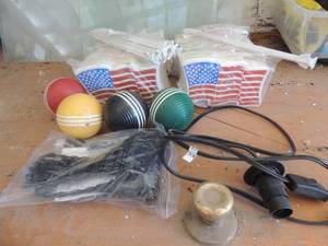 lot 482 image: 4 Croquet balls, .  new 10mini flag dcor, x 2 paks of 4 .   used light fixture plug