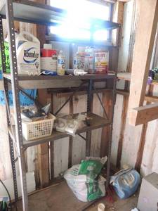 lot 487 image: 6metal shelf. Contents included (paint, roundup spray, light bulbs, paint rollers, water putty, Intermatic programming waterproof sealant.
