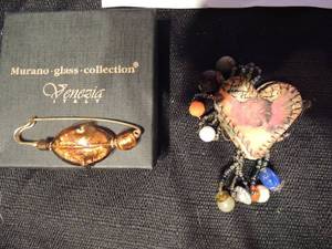 lot 531 image: 2 art pins- 1 metal and bead by Monique Duale 1992 and the other amber & gold