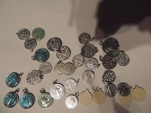 lot 539 image: Catholic medals St. Benedict 10 large 20 small still have paper covers