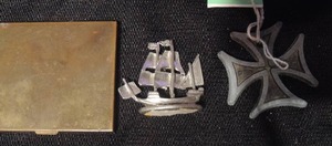 lot 556 image: Pewter mayflower replica, Surfers cross and vintage gold powder compact (powder is still there)