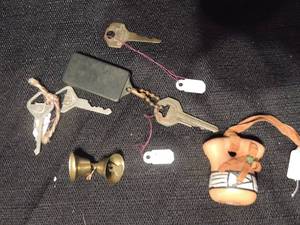 lot 557 image: Santa Fe 1992 potter piece mini, 3 vintage ford car keys, 2 brass bells