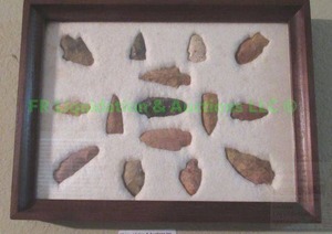 lot 17 image: Genuine arrowhead collection framed