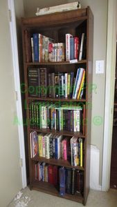 lot 297 image: Bookshelf and books as shown