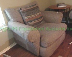 lot 37 image: Arm chair with throw pillow