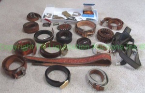 lot 67 image: Sterling silver Mexico belt buckle and parts plus assorted leather belts and belt buckles