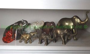 lot 167 image: Herd of elephants, glass, brass and ceramic