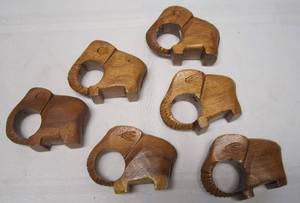 lot 687 image: 6 Hand Carved Solid Wood Napkin Rings
