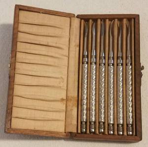 lot 10 image: VINTAGE SET OF 6 NUT PICKS WITH STORAGE BOX