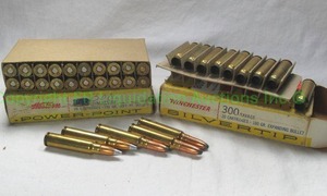 lot 408 image: Savage .300 reloads 1 box full plus 5 extra rounds and empty casings