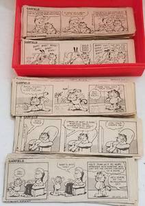 lot 94 image: VINTAGE GARFIELD COMIC STRIPS IN A BOX