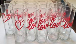 lot 145 image: LOT OF 17 TALL GLASS VASES (10 INCHES HIGH)