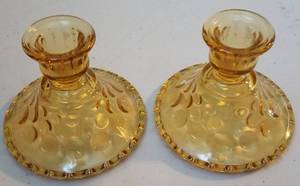 lot 169 image: LOT OF 2 AMBER GLASS CANDLE STICK HOLDERS