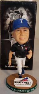 lot 330 image: BUCK SHOWALTER BOBBLE HEAD FIGURE
