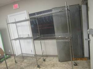 lot 331 image: TWO SECTION INDUSTRIAL CHROME MOBILE WIRE SHELVING&nbsp