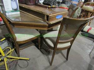 lot 132 image: Octagon shape dining table with leafs and matching chairs