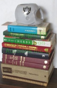 lot 207 image: Assorted books and LA Raiders figural helmet coffee cup
