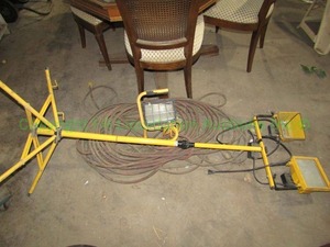 lot 134 image: Halogen utility lamp stand and portable lamp plus extension cords