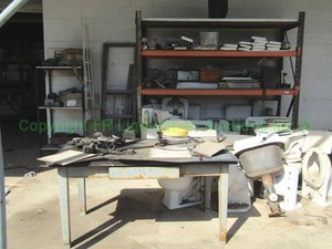 lot 375 image: Porcelain toilets, misc. parts and more as shown, generous quantity. PALLET RACK UNIT NOT INCLUDED