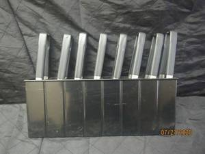 lot 380 image: TOTAL OF 8 VOLLRATH BLACK UTILITY TONGS 47809 WITH 8 SECTION TONG HOLDER&nbsp