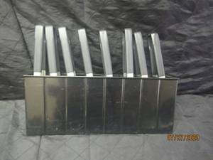 lot 381 image: TOTAL OF 8 VOLLRATH BLACK UTILITY TONGS 47809 WITH 8 SECTION TONG HOLDER