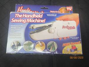 lot 24 image: THE HANDY STITCH HANDHELD SEWING MACHINE&nbsp