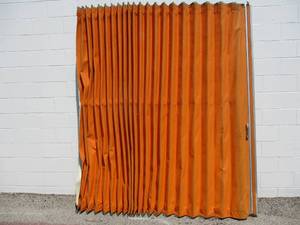 lot 155 image: VINTAGE -HARD PLASTIC LIKE FABRIC ACCORDION PARTITION, BURNT ORANGE