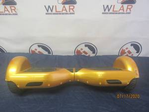 lot 139 image: GOLD HOVERBOARD TESTED AND WORK WILL NEED CHARGER&nbsp