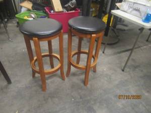 lot 206 image: DUO BACKLESS WOOD LEATHER BAR STOOLS&nbsp&nbsp 15 DIAM X 19  H&nbsp ONE LEG NEED REPAIR&nbsp