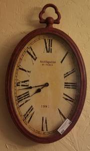 lot 59 image: OVAL WALL CLOCK (14W X 24H)