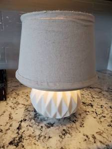 lot 47 image: Small White Ceramic Table Lamp with Linen Shade