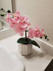 lot 126 image: Faux Pink Orchid in White Ceramic Vase