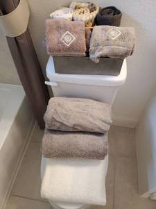 lot 143 image: Group of Cotton Towels with MetalWood Container