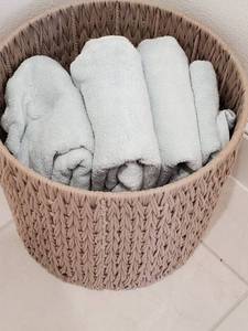 lot 9 image: Woven Rope Basket with Aqua Towels