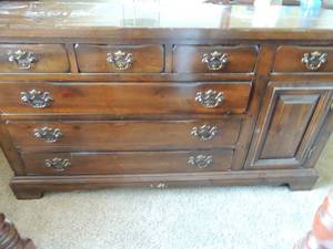 lot 15 image: Solid Dark Wood 7 drawer  dresser with Mirror unit. 2 drawers, 6 small  shelves. 60  Dresser door missing a knob