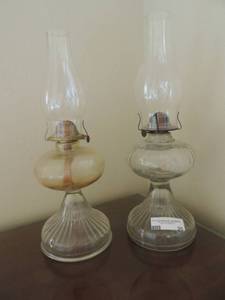 lot 20 image: Antique clear glass hurricane oil lamps with chimneys 18H Set of 2