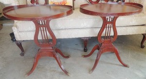 lot 26 image: Antique oval side tables with carved lyre support and brass claw feet on reeded cabriole legs. Raised lip top 28x18x24 great condition Set of 2