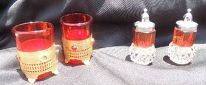 lot 39 image: 2 red and gold cordial glasses with metal holder and salt & pepper shakers