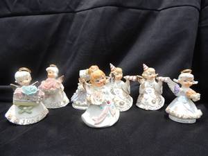 lot 45 image: 7 Lefton angel figurines - August, January, November, and June. Mondays child