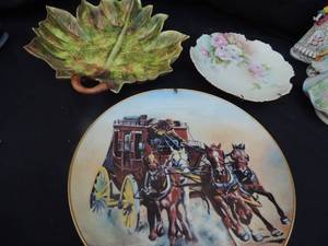 lot 58 image: Hell Bent Ltd Ed. Western Series plate of man with horse and buggy  8   &  Majolica Green leaf design plate (chip) 13x11,   Pink rose wall plate by E.M. Suthord 8