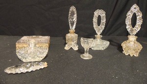 lot 82 image: Assorted Vintage crystal perfume bottles, trinket box and eye wash cup, 1 bottle the top piece broken