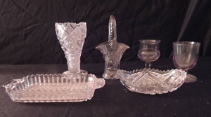 lot 84 image: Amethyst glass pieces. Includes serving tray, vase, basket candy dish and more