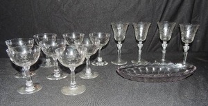 lot 87 image: 8- 4 champagne glasses, 4- 6 wine glasses, and 9 oval dish