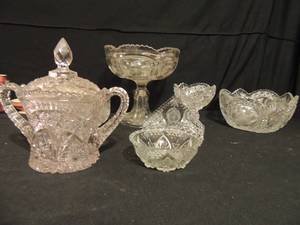 lot 93 image: Crystal and pressed glass lot. Includes bowl with hummingbirds on sides, 9 tall fruit bowl, covered dish, napkin holder and much more