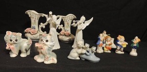 lot 104 image: 4 figurines marked Occupied in Japan 3 tall, 2 white angels marked SB on bottom 5tall, 2 pink rose vases