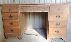 lot 120 image: Solid wood 7 drawer desk 30x53x23 needs good cleaning