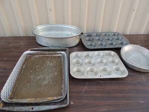 lot 135 image: COOKWARE -muffin pans, cookie sheets, cake pans, and roaster with no lid
