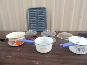 lot 137 image: Orange Sanko saucepan,  2 white and purple sauce pans and assorted casserole lids